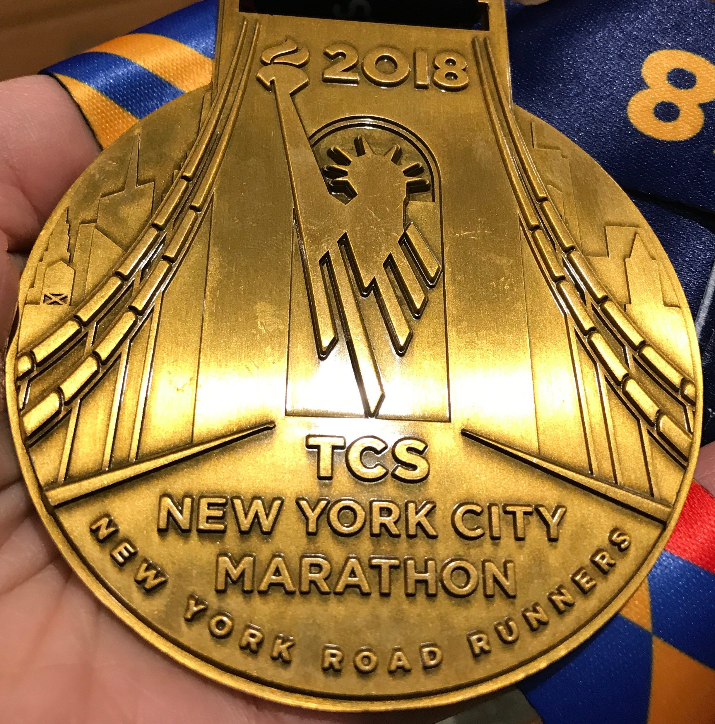 cropped-cropped-nyc-marathon-2018-finisher-medal_sloan-alexander.jpg